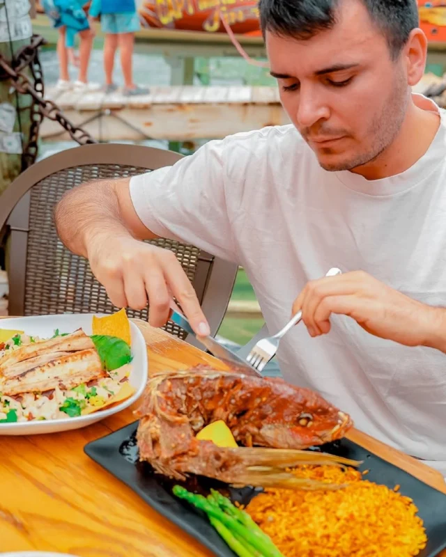 The ultimate seafood feast! 🐟🍋 Dive into a fresh, crispy whole fried fish served right by the water. This is what a real Florida Keys lunch looks like! 🤤🌊